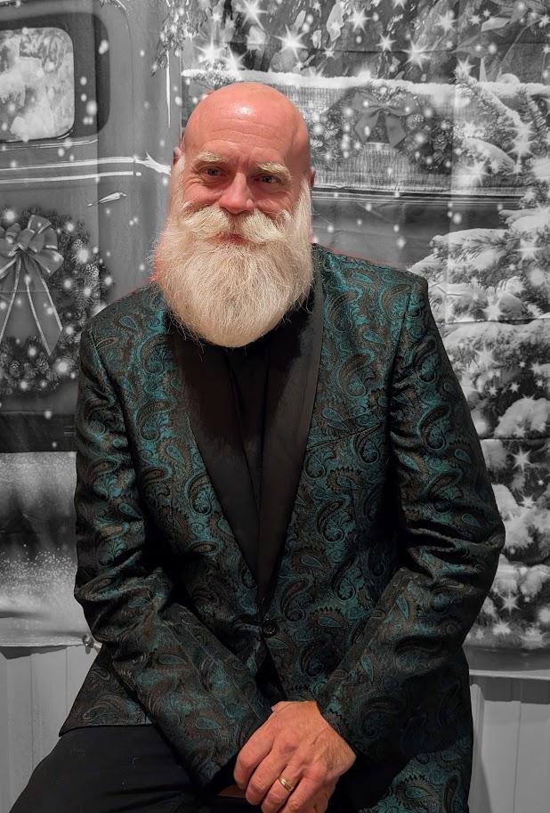 Santa in a green patterned sport coat